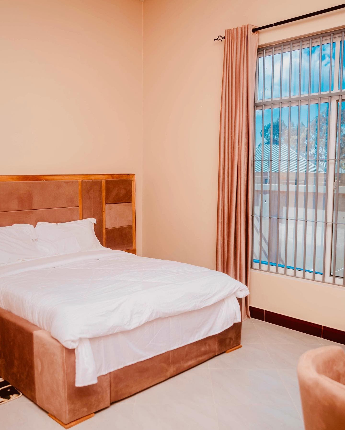 Guest room at The Great Rotale with a bed beside the window